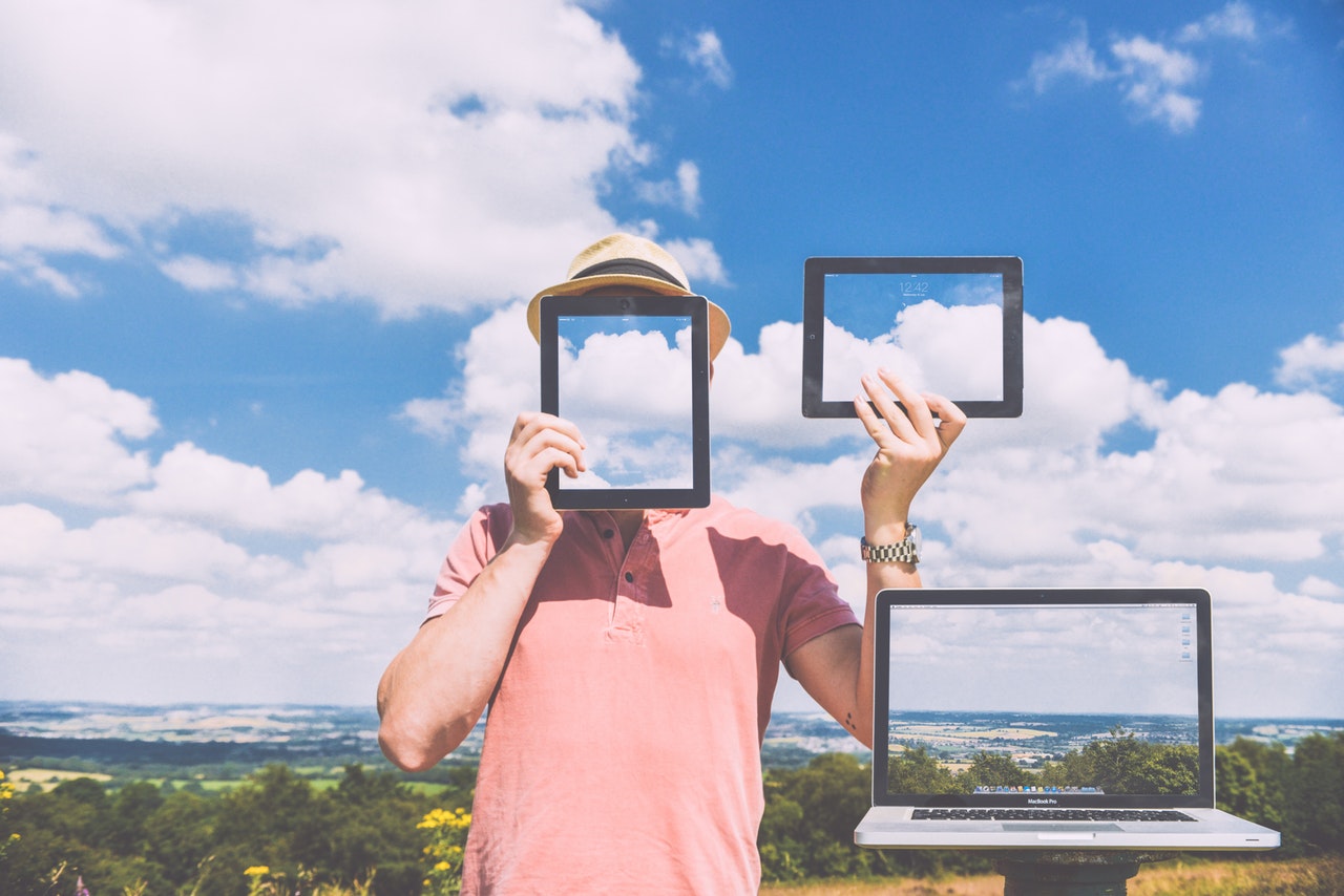 How to claim lottery jackpot winnings while keeping your identity secret A man hides behind blank screens of devices to remain anonymous