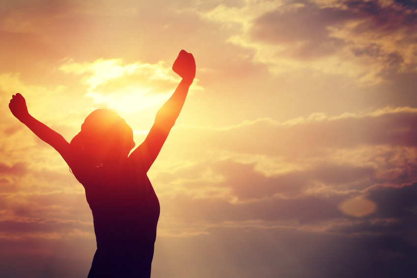 Woman greets the dawn with happiness after discovering results of the Powerball draw. 